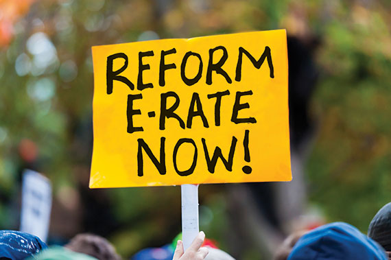 Printed sign: Reform e-rate now!