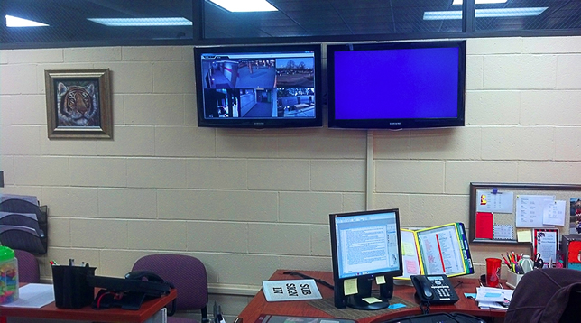 The administrative offices rotate video feeds on publicly viewable displays.