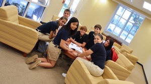 Oxbridge Academy students in the "cafe" side of the iCommons library