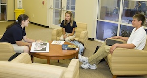 Oxbridge Academy students in the "cafe" side of the iCommons library