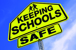 street sign: keeping schools safe