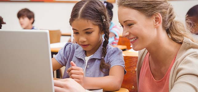 teacher helping student