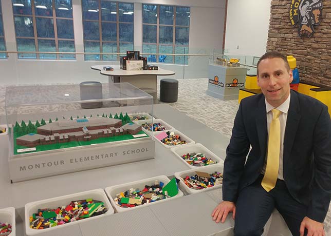 Montour Elementary Co-Principal Jason Burik is also an accomplished Lego artist. He's pictured here at the Brick Makerspace's central feature: the Creation Station.