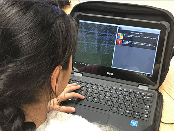Female student using Minecraft