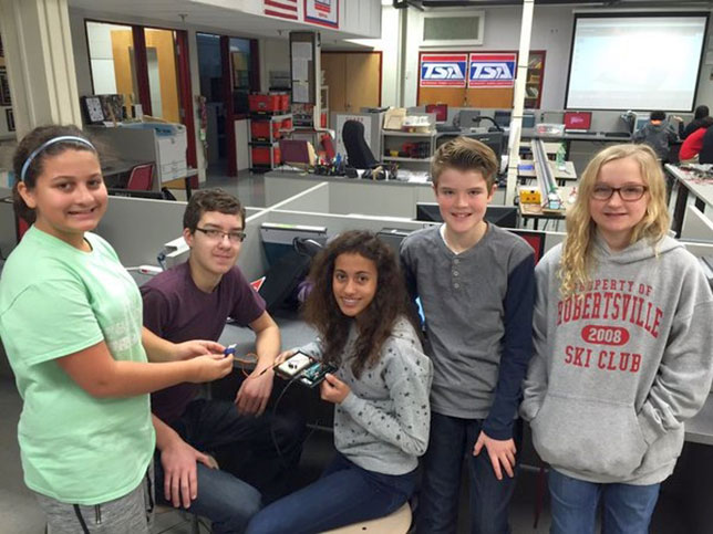 Robertsville Middle School students work with Arduinos for a cubesat project.