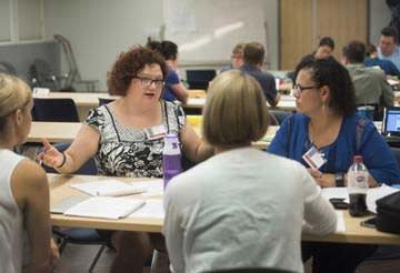 Teacher Laura Rangel, left, works with a group of other educators to plan a world history lesson using primary sources during a summer teaching event at the University of California, Davis. Source: UC Davis/Karin Higgins 