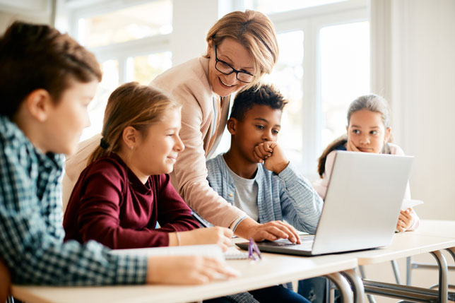 elementary school teacher with students