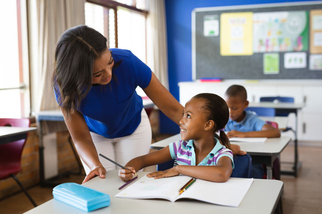 elementary school teacher with students