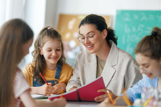 elementary school teacher with students