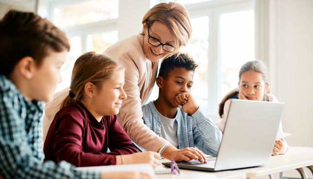 elementary school teacher with students