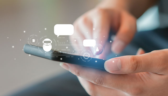 closeup of hands using smartphone to talk with ai chatbot 