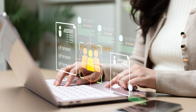 woman working on laptop with virtual community interface