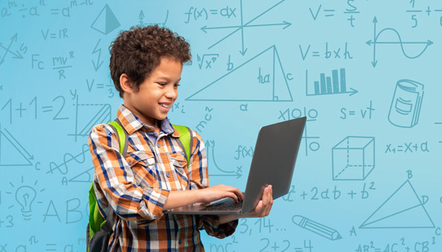 child stands with a laptop, in front of various drawings related to math and science