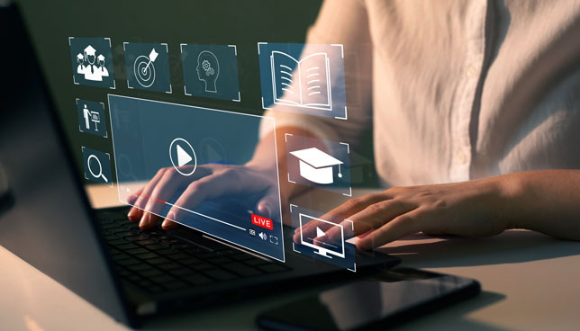 teacher creating lessons on a laptop