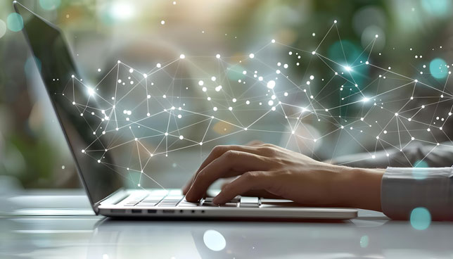 closeup of hands typing on a laptop