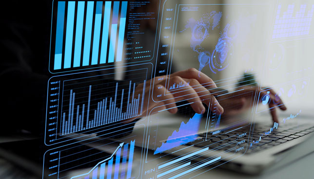 closeup of hands typing with data analytics overlay