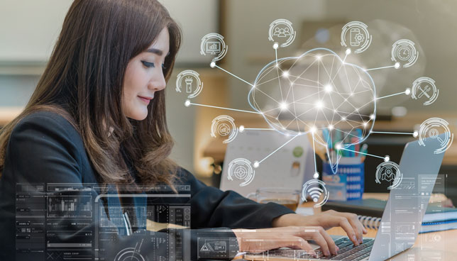 woman working with computer laptop with polygonal brain shape of an artificial intelligence and various icons