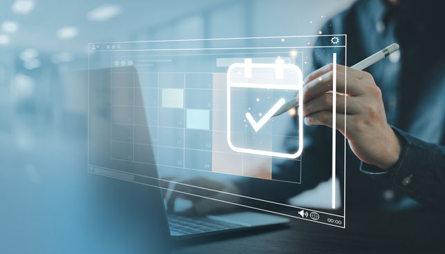 person typing on a touch screen schedule plan calendar