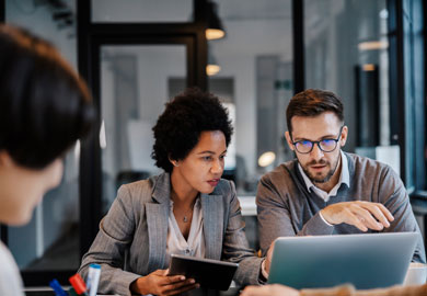 executives are sitting at the boardroom and solving problems
