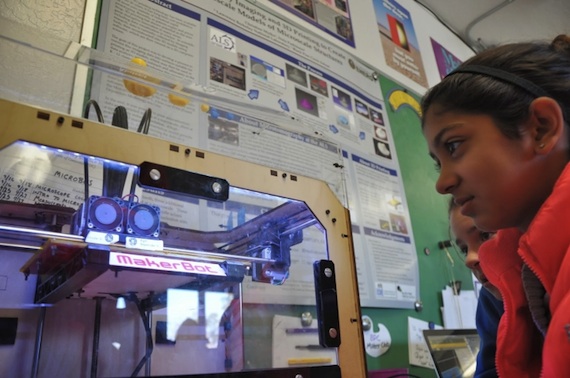 Students Inika Bhatia and Hayley Sullivan monitor a print job. (Photo courtesy of Christine Mytko.)