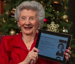 Milby High School alumna Florence Waters holds a digitized version of the school's yearbook from 1936.