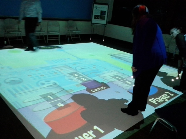 SMALLab projects a computer display that students can directly interact with.
