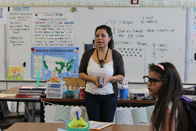 New River Elementary third-grade Teacher Linda Fox uses a microphone as part of an audio enhancement system that projects her voice to students.